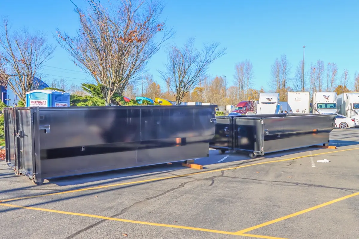 Professional dumpster rental service with roll-off container on residential driveway in Cullowhee